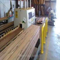 Milling Pecky Bolivian Walnut into ceiling planks.