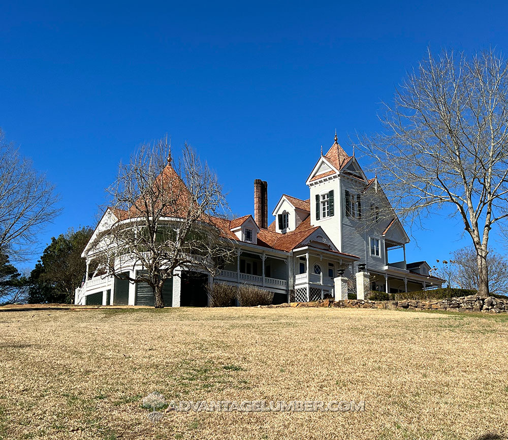 Newly installed wallaba roofing shingles on a farmhouse.